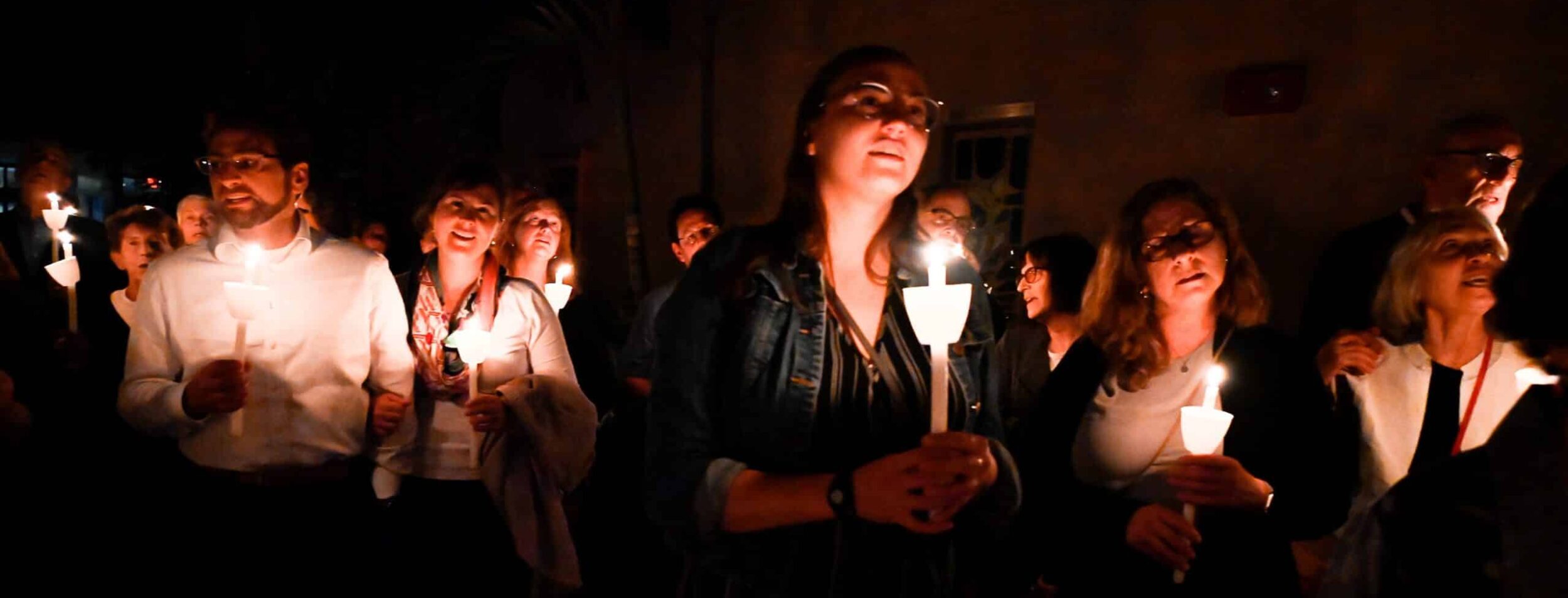 TI congregants holding candles during the S'lichot service