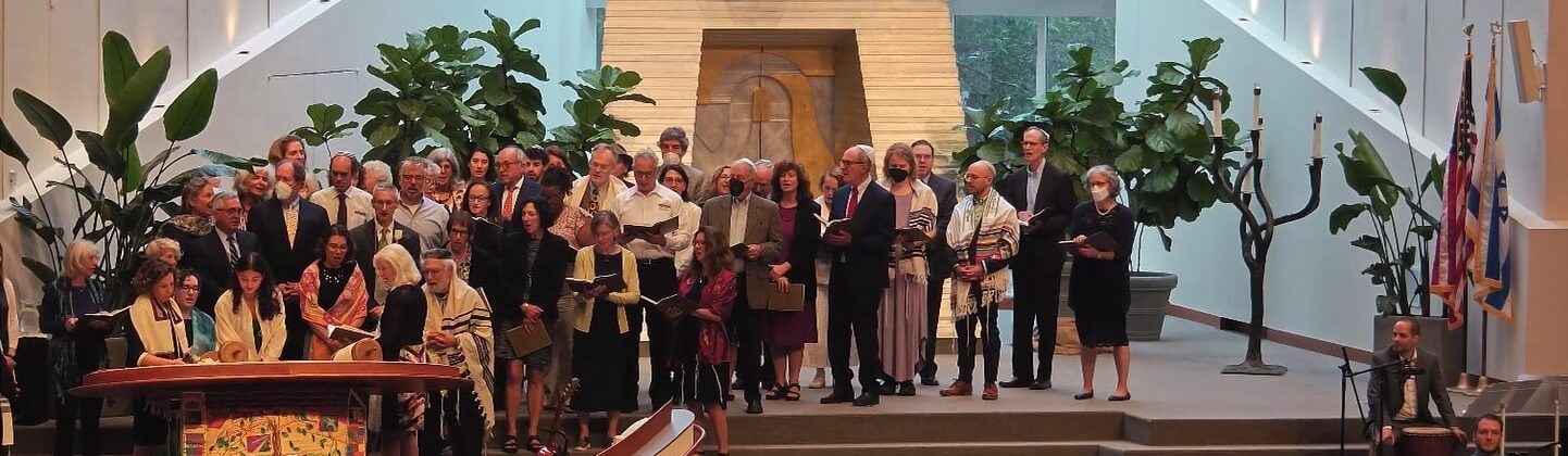 Congregation on the bima during Torah reading