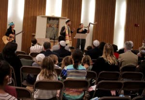 Blowing the shofar at a family High Holy Day service at Temple Israel of Boston