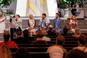 Rabbi Jacobson blowing the shofar; the other TI clergy seated next to her.