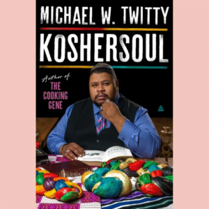 Koshersoul by Michael W. Twitty book cover with a picture of the author seated at a table with very brightly colored loaves of challah